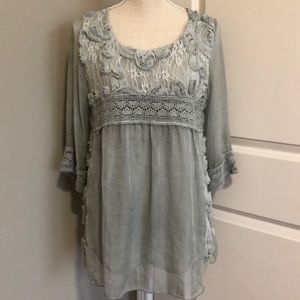 green top with rosette detail